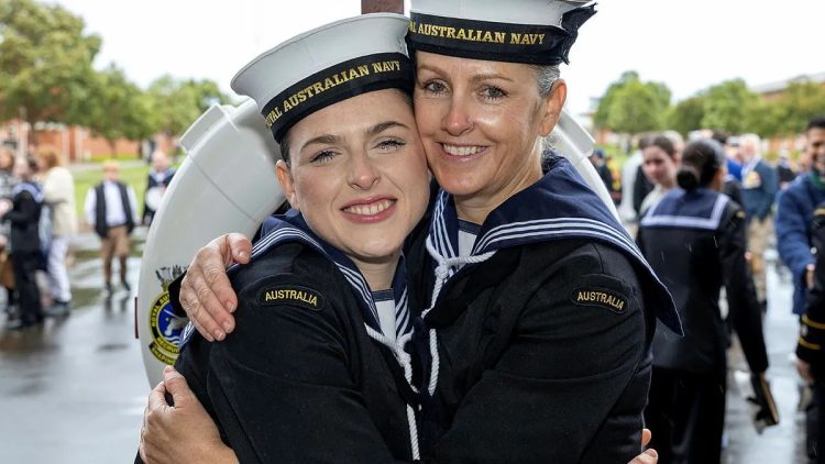 Mother And Daughter Sailing Side By Side   